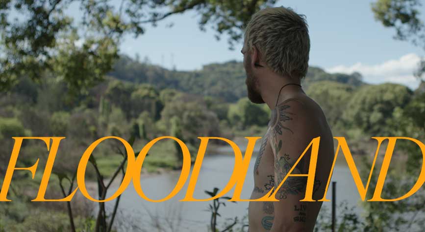 FLOODLAND — Man looks over lake
